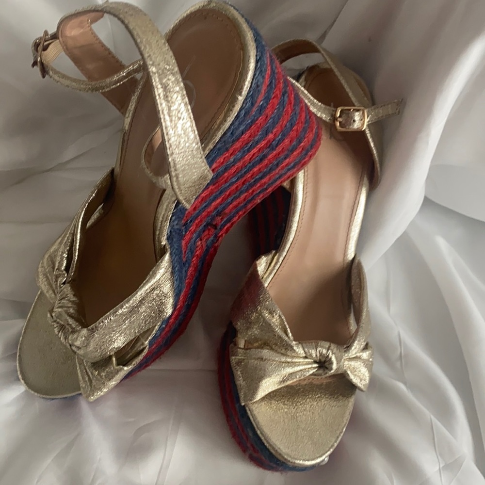Gold colored platform sandals with blue and red colored soles.  Women's size 10.